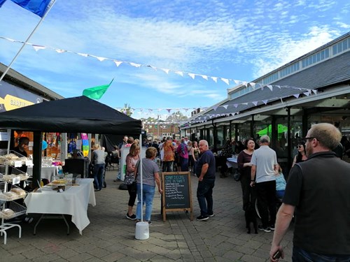 Image of punters at Electric Nights street food event at Tiverton Pannier Market